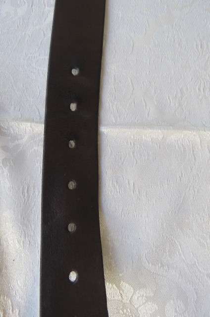 Genuine leather brown belt with holder. Length 108 cm. Made in Europe. Used but in good condition.