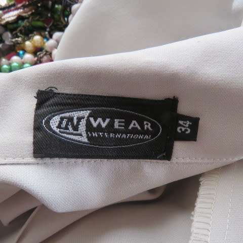 Beatiful beige sleeceless jacket closing with 2 buttons on front. Size 34/10 by INWEAR. New cond.