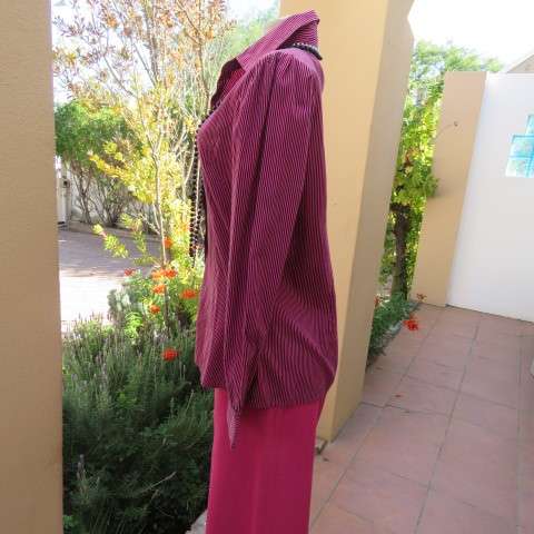 Pretty styled long sleeve blouse in magenta pink and black vertical stripes. By RT in size 38/14