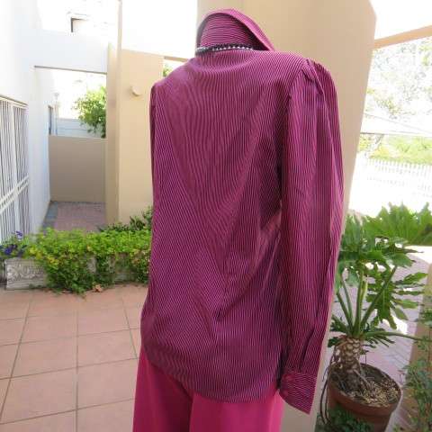Pretty styled long sleeve blouse in magenta pink and black vertical stripes. By RT in size 38/14