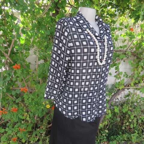 Black and white square patterned top by 'Lisa Spinelli' size 34/10. Elbow length sleeves. As new.