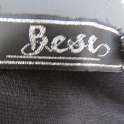 Black shiny pull over V neck ,sleeveless top that resembles vinyl on front. Size 34/10 by BESTS.