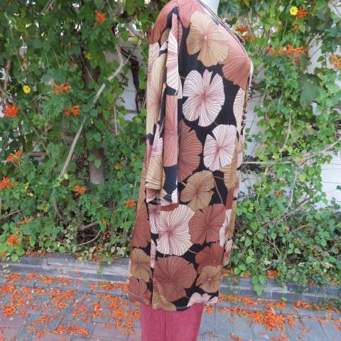 Silky dark brown slip over top with bold beige,gold and brown floral pattern. Short sleeves. Size 50