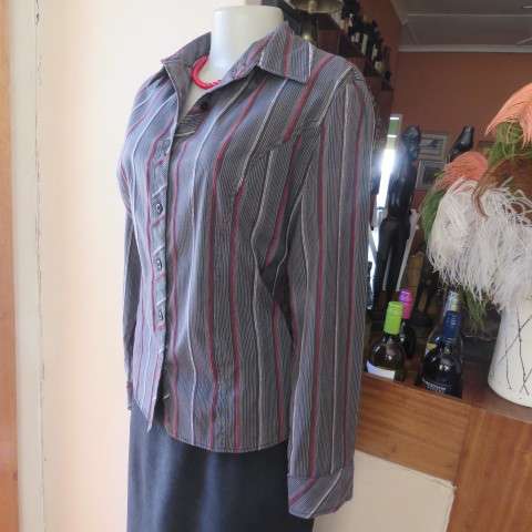 Power print top in red,black and white by FASHION EXPRESS in size 36/12. Button down.New cond.