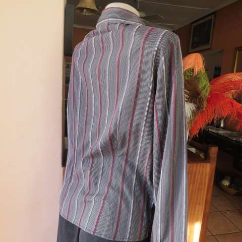 Power print top in red,black and white by FASHION EXPRESS in size 36/12. Button down.New cond.