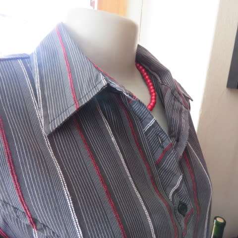 Power print top in red,black and white by FASHION EXPRESS in size 36/12. Button down.New cond.