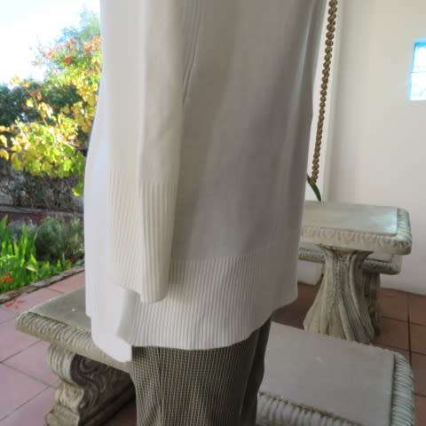 Soft cream colour long pull over cardigan with cowl neckline. In 100% acrylic yarn. Size 38 to 40