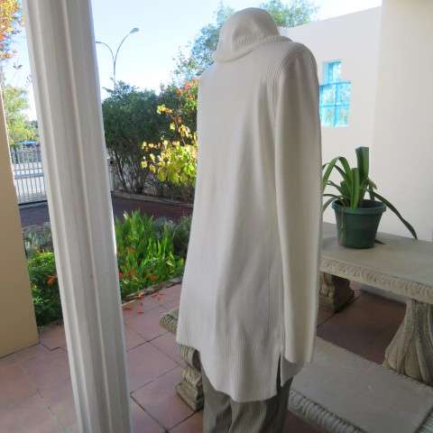Soft cream colour long pull over cardigan with cowl neckline. In 100% acrylic yarn. Size 38 to 40