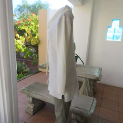 Soft cream colour long pull over cardigan with cowl neckline. In 100% acrylic yarn. Size 38 to 40