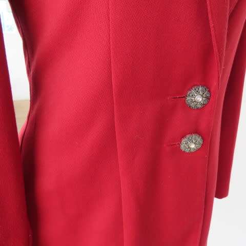 Show stopping red peacoat style long sleeve jacket closing with 2 buttons. Pleats at back.Size 34/10