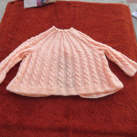 New hand knitted baby jacket.Knitted with acrylic yarn.Small cable pattern.3 to 6months Long sleeves