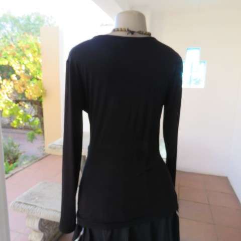 Fabulous used black sexy long sleeve top from IQ in size 38/14.Low plunging neckline.Front buckle