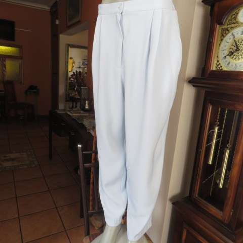 Best quality RAOUL pant suite in size 40 to 42. Pale blue colour. In 100% polyester fabric. New cond