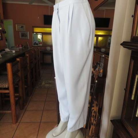 Best quality RAOUL pant suite in size 40 to 42. Pale blue colour. In 100% polyester fabric. New cond