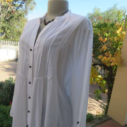 Oversized white cotton long top with button down front and decorated bib.Size 50/26. New condition