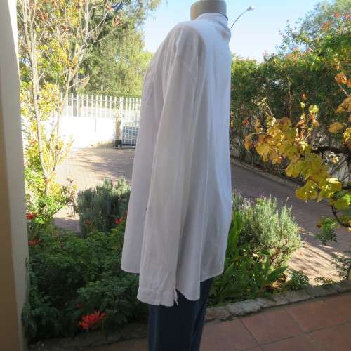 Oversized white cotton long top with button down front and decorated bib.Size 50/26. New condition