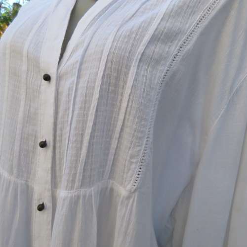 Oversized white cotton long top with button down front and decorated bib.Size 50/26. New condition