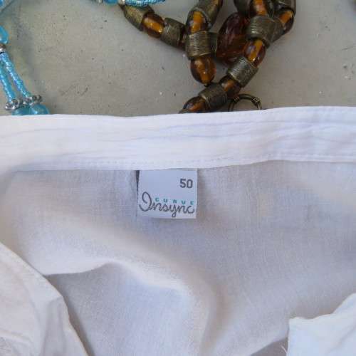 Oversized white cotton long top with button down front and decorated bib.Size 50/26. New condition