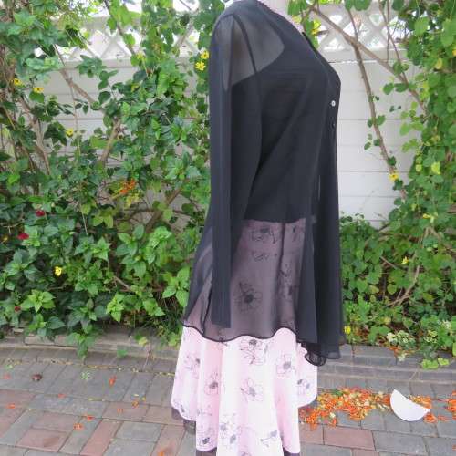 Waterfall style sheer black long sleeve top with V front size 38/14. In 100% polyester fabric.