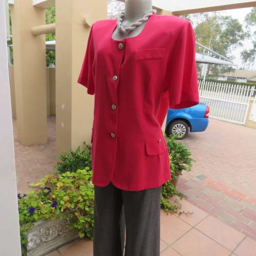 Elegant candy red short sleeve summer jacket. Collarless. Size 40/16 by `Merien Hall`. As new.