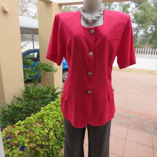 Elegant candy red short sleeve summer jacket. Collarless. Size 40/16 by `Merien Hall`. As new.