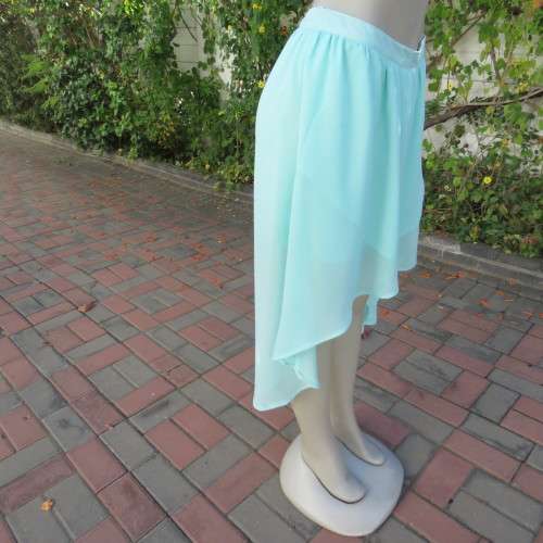 Sexy pale turquoise asymetric skirt with fold over front. Size 36/12. Sheer polyester partly lined.