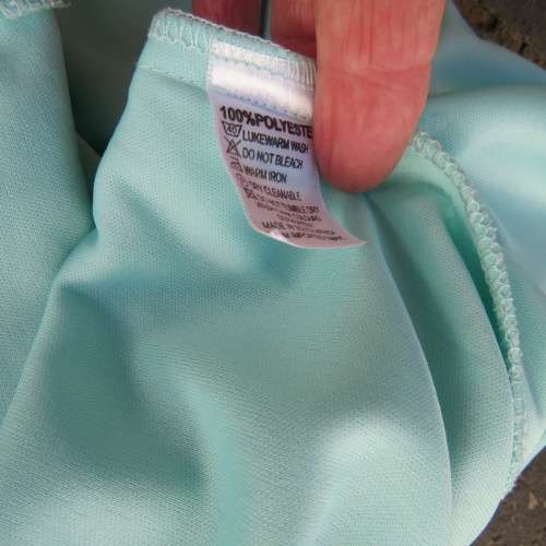 Sexy pale turquoise asymetric skirt with fold over front. Size 36/12. Sheer polyester partly lined.