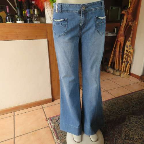 Wide legged blue denim jeans in size 38/14. Cute front pockets.In stretch polycotton. As new