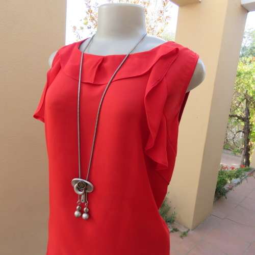 Pretty bright red sleeveless top with stretch viscose back and polyester front size 40/16. As new.