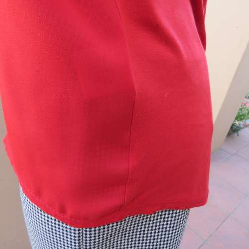 Pretty bright red sleeveless top with stretch viscose back and polyester front size 40/16. As new.