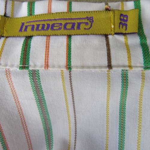 Smart embossed striped cross over top. Size 38/14 by INWEAR Long cuffed sleeves. New condition.