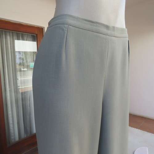 Comfy ankle length fern green pants in size 40/16 by `WOOLWORTHS`. In 100% wash + wear polyester.