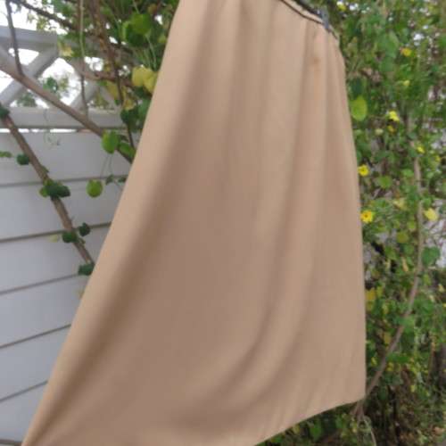 Rich cream colour pencil skirt in size 46/22 by ASPIRE. Black edging on front waistband. Good cond.