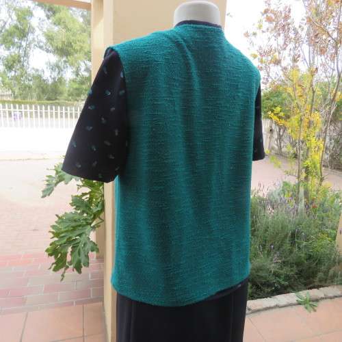 Textured teal colour open hanging sleeveless top in size 38/14. With pleats on front. As new.