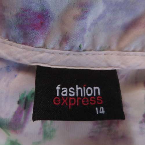 Casual but smart zipup long sleeve top in white with cheerful pattern. Size 38/14 by FASHION EXPRESS
