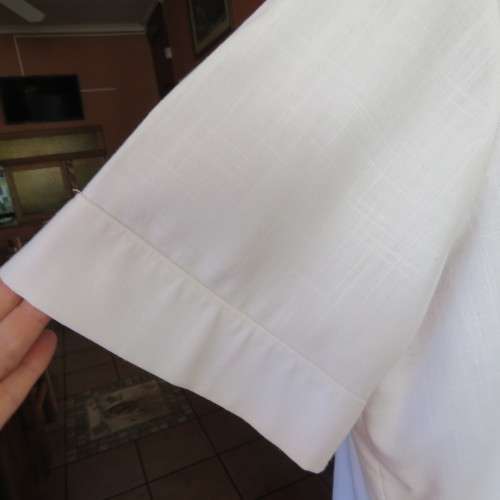 Smart white short sleeve summer jacket with button down front. Size 46 to 48. New condition.