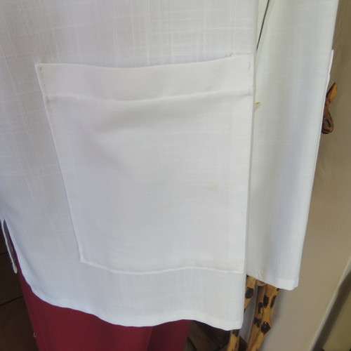 Smart white short sleeve summer jacket with button down front. Size 46 to 48. New condition.