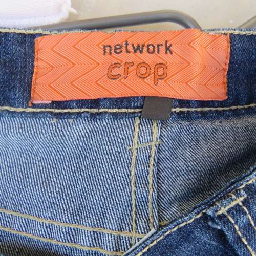 Chic denim cropped jeans with pockets on leg sides. Front and dummies at back size 34/10 by NETWORK.