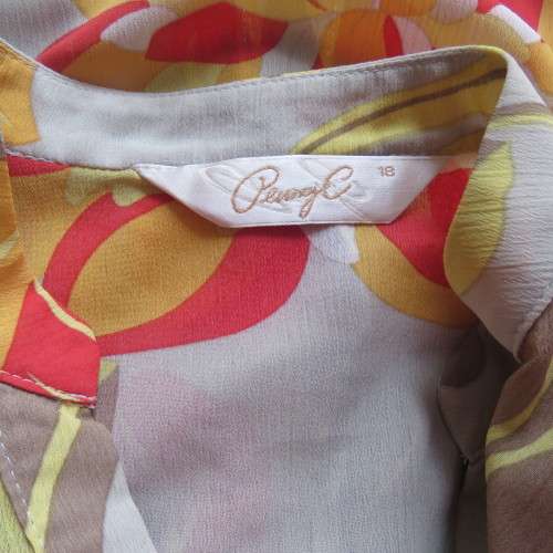Cheerful PENNY C top in yellow,beige,red and orange floral design. Size 42/18. Very good cond.