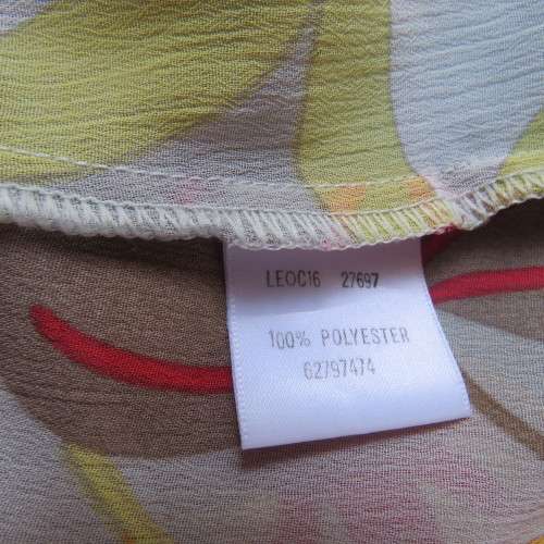 Cheerful PENNY C top in yellow,beige,red and orange floral design. Size 42/18. Very good cond.