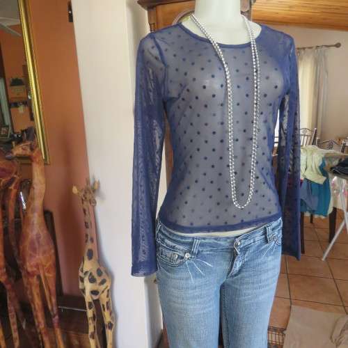 Smart long sleeve navy top in stretch netting  with embossed dots. Size 36/12 by RT. Good condition