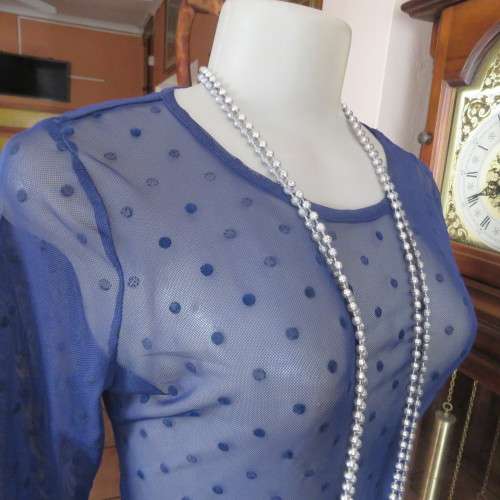 Smart long sleeve navy top in stretch netting  with embossed dots. Size 36/12 by RT. Good condition