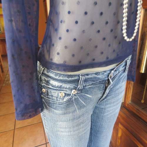 Smart long sleeve navy top in stretch netting  with embossed dots. Size 36/12 by RT. Good condition