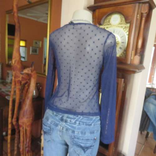 Smart long sleeve navy top in stretch netting  with embossed dots. Size 36/12 by RT. Good condition