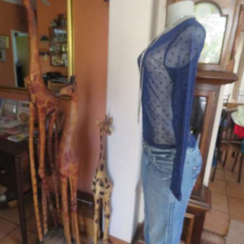 Smart long sleeve navy top in stretch netting  with embossed dots. Size 36/12 by RT. Good condition