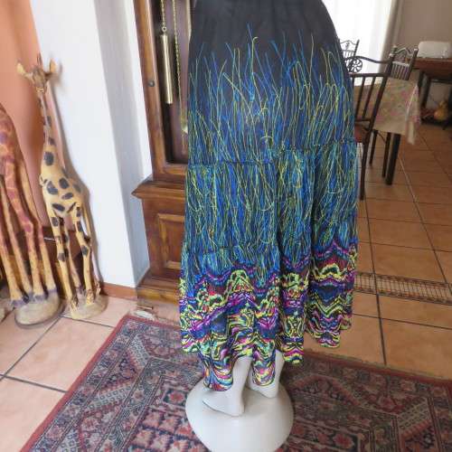 Eyecatching tiered skirt. Ankle length in sheer polyester. Size 40/16 by FASHION EXPRESS. As new.