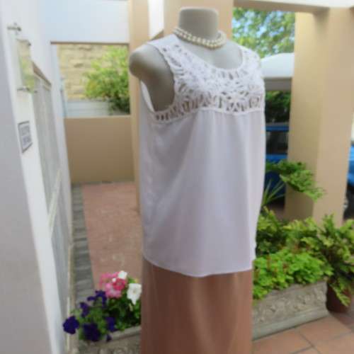 Stunning DELTON white sleeveless top. Amazing see-through ribbon decoration. Size 36/12. As new.