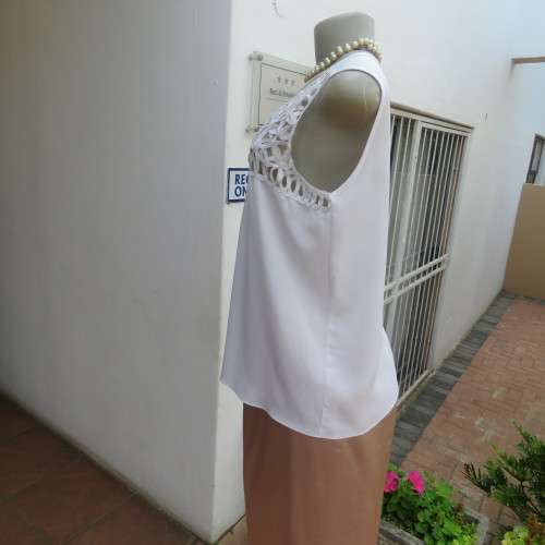 Stunning DELTON white sleeveless top. Amazing see-through ribbon decoration. Size 36/12. As new.