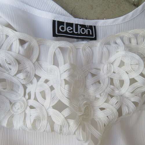 Stunning DELTON white sleeveless top. Amazing see-through ribbon decoration. Size 36/12. As new.