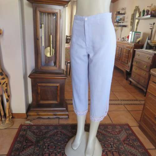 Fabulous cropped powder blue high waist pants crochet decoration on legs. Size 34/10 New condition.